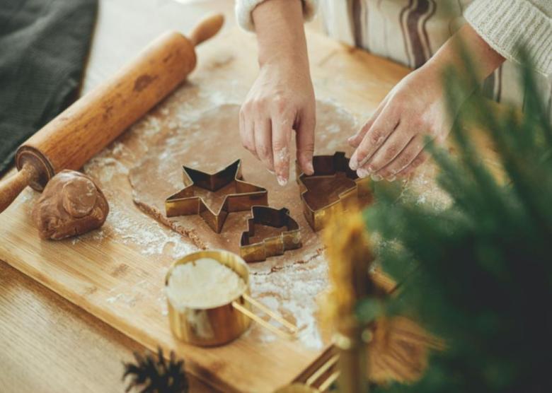 Salt and yeast doughs A person cutting out gingerbread cookies.