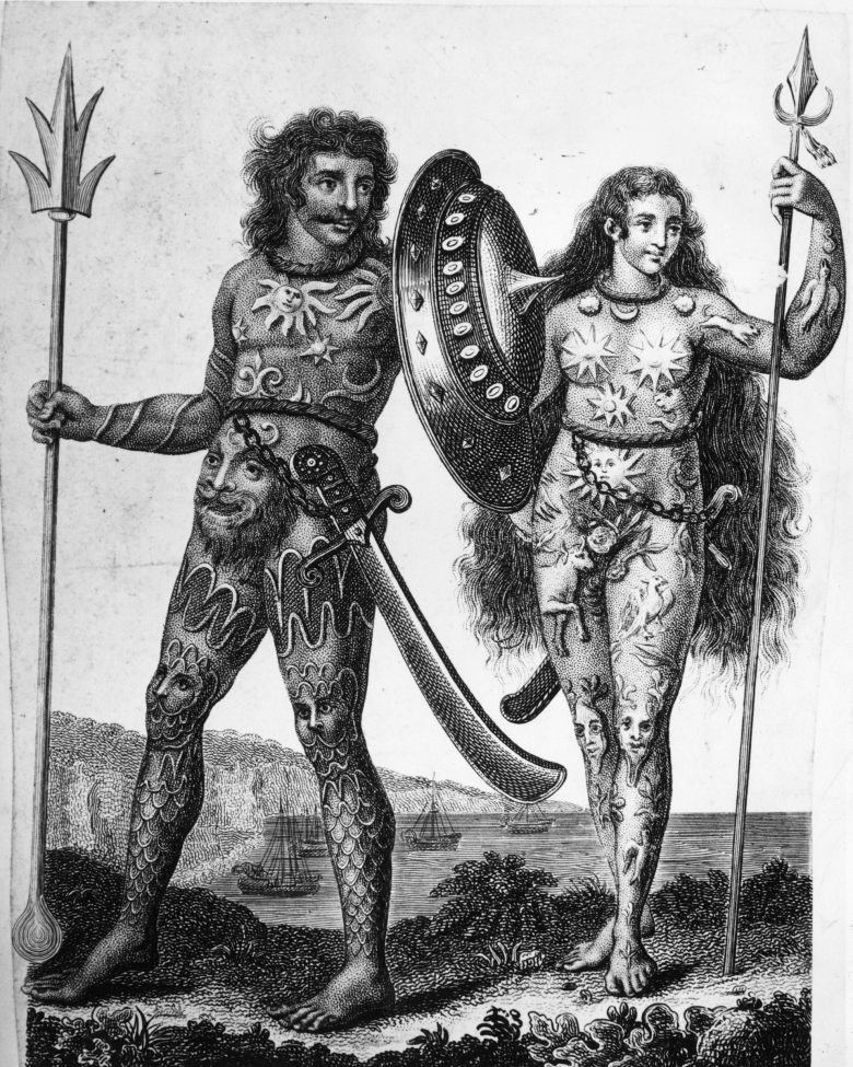 A black and white illustration showing a man and woman covered in body art, holding spears in their hands.