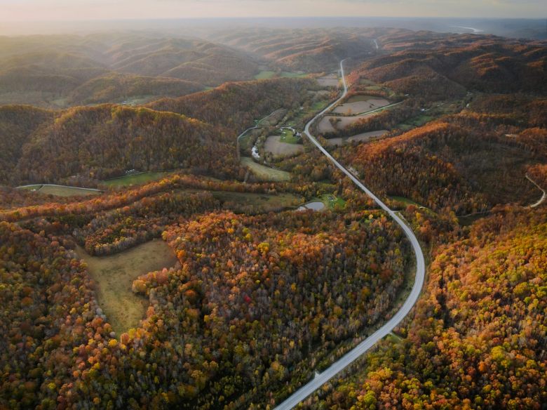 In an aerial view of Kentucky's mountains, now-flat areas where mountain top were mined for their coal are visible.