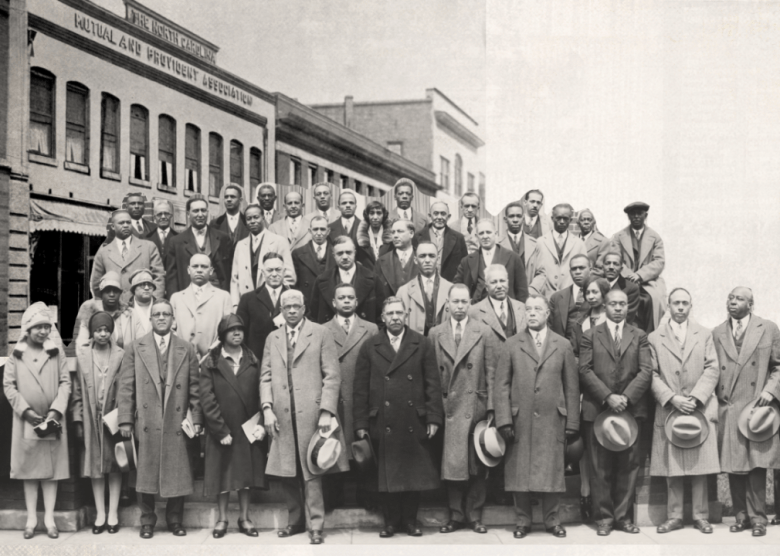 Where Black Americans found success across the US Group portrait of the National Negro Insurance Association and The North Carolina Mutual Block on Parrish Street in Durham.